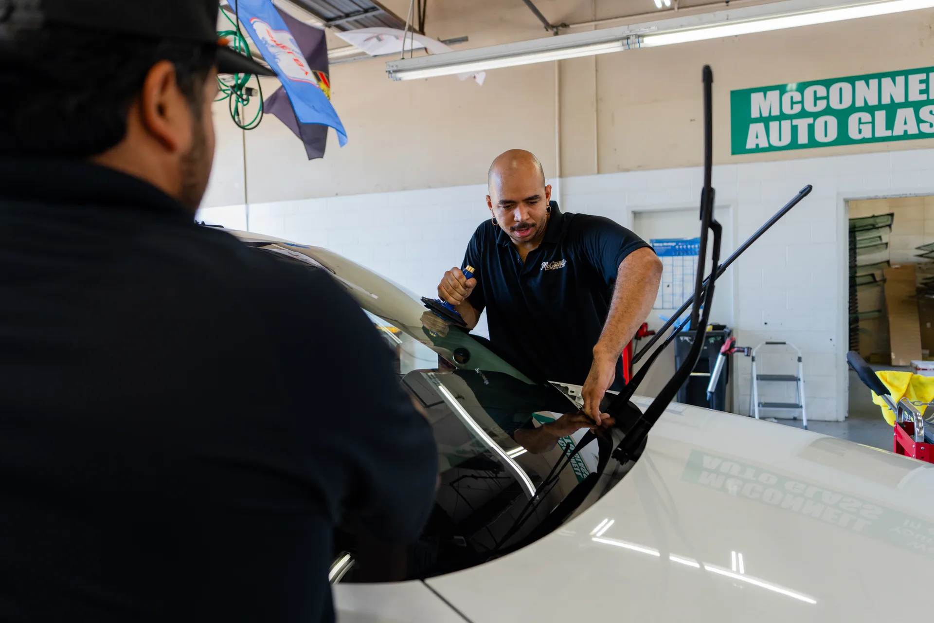 McConnell team working together on a vehicle windshield in the Raleigh shop